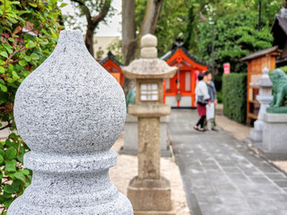 Stone decorations and lanterns near the shrine