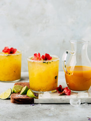 Fresh mango mojiton cocktail with flowers