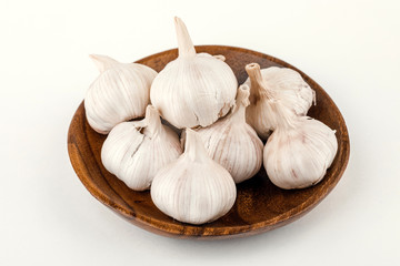a plate of garlic isolated on white background