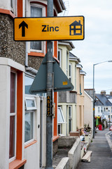 english village with sign Zinc