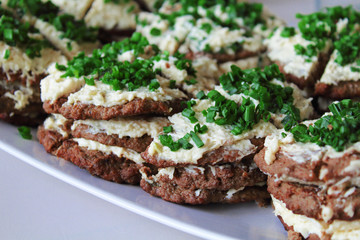 Grilled liver with garlic, mayonnaise and cheese. Close-up. Background.