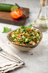 Healthy salad with mung beans, tomatoes, cucumber, lettuce and greens