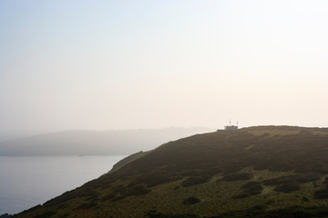 Fototapeta na wymiar house on the edge of cliffs