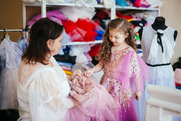 Dressmaker designer dresses communicates with customer