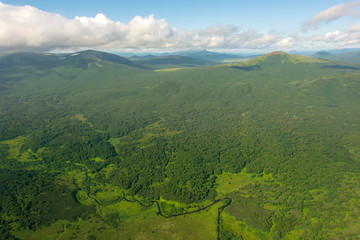 aerial view of Kamchatka volcanos, green valleys, snow and ice and the wonderful view of pure nature.