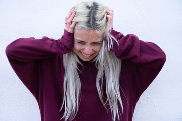 portrait of a girl in winter clothes crying
