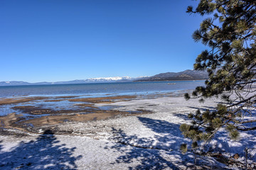 Beach covered by snow along the Lake Tahoe in California