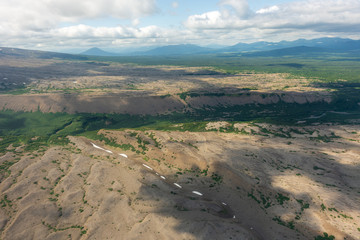 aerial view of Kamchatka volcanos, green valleys, snow and ice and the wonderful view of pure nature.