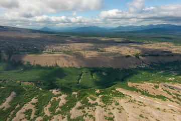 aerial view of Kamchatka volcanos, green valleys, snow and ice and the wonderful view of pure nature.