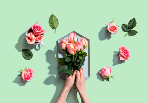 Woman Holding Pink Roses Overhead View - Flat Lay