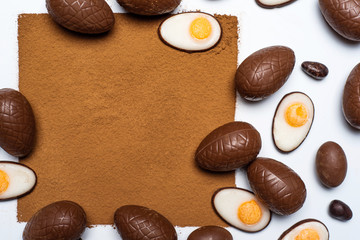 Chocolate Easter eggs and space for text of cacao