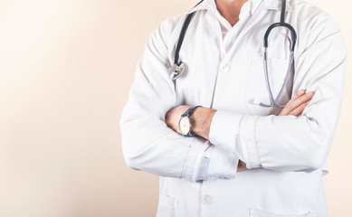 doctor posing with arms crossed and stethoscope