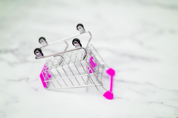 Fototapeta premium Shopping trolley on light background