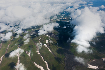 aerial view of Kamchatka volcanos, green valleys, snow and ice and the wonderful view of pure nature.