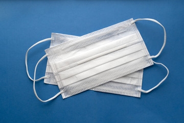 COVID-19. Facial masks on the pile. Epidemic and epidemic background. Medical masks for protection.