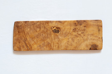 Kitchen boards made of natural olive wood on a white background. Eco-friendly dishes.
