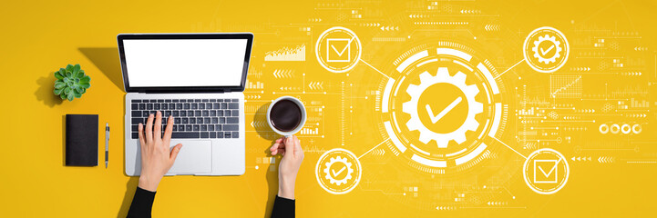 Quality control approval with person using a laptop computer