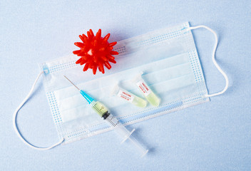 Test tube with blood sample Covid-19 (coronavirus). Laboratory testing blood. Vaccine and syringe...