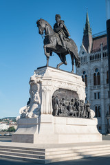 Obraz premium Budapest Parliament building with the Count Gyula Andrassy equestrian statue originally installed in 1906 then demolished by the Communist authorities after 1945, Hungary 2019