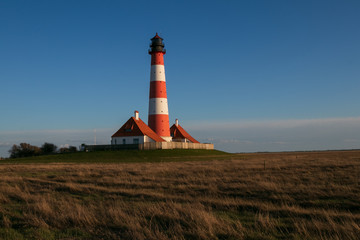 Fototapeta na wymiar Leuchtturm Westerhever, Nordsee, Halbinsel Eiderstedt, Nordfriesland, Schleswig Holstein 