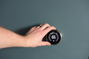 Fototapeta premium Green tech- Electric thermostat to save money and energy