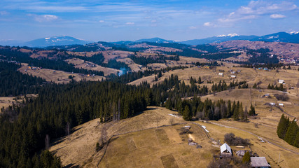 Naklejka premium Alpine village settlement of a house on top of a mountain aerial photo Carpathians Ukraine.