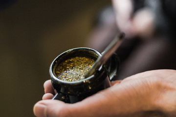 hands holding a cup of tea