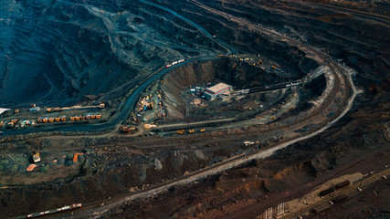 Obraz premium Aerial view of the Iron ore mining, Panorama of an open-cast mine extracting iron ore, preparing for blasting in a quarry mining iron ore, Explosive works on open pit