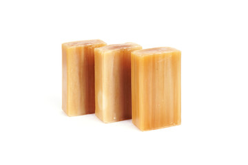 Universal antibacterial natural laundry soap. Brown bar of natural soap Isolated on a white background.