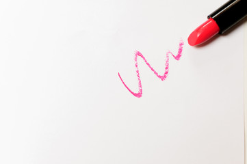 Red lipstick with trace over white background.