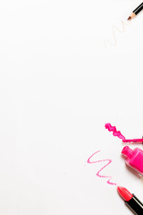 pink lipstick, pink nail polish and pink eyelash trace.