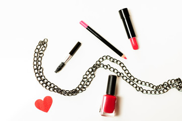 Make up cosmetic bag with professional accessories. Lipsticks and brushes in a black cosmetic bag in white background