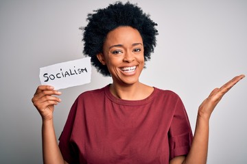 Young African American afro politician woman with curly hair socialist party member very happy and...