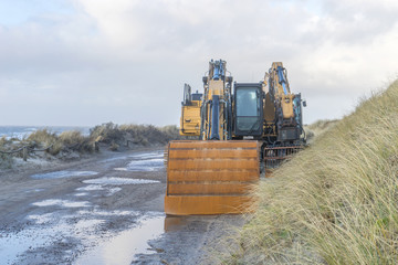 Excavator on a sand dune on the island of Sylt