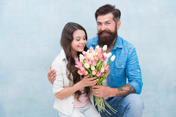 Birthday celebration. International womens day. Flower shop. Family tradition. She worth all treasures. Tender tulips for daughter. Man tulips bouquet. Father giving tulips girl. Dad with flowers