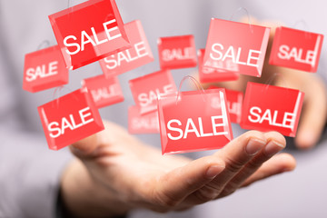 Hand Holding Red Percentage Sign 3d