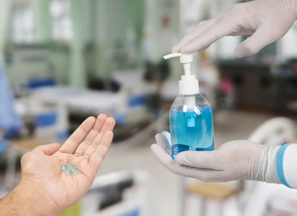 Ethyl alcohol sanitizer in a hand of the doctor for cleaning hand and used as disinfectant,Covid-19,Corona virus.