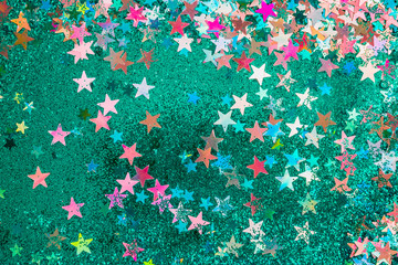 green sparkles and multicolour stars background