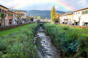 Fototapeta na wymiar Creek flows between houses in Rome. Italy