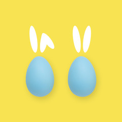 Easter blue and yellow eggs on a colored background with painted rabbit ears.