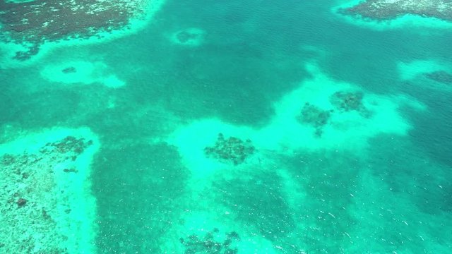 4K Flying over The Blue Hole coral reef in Belize