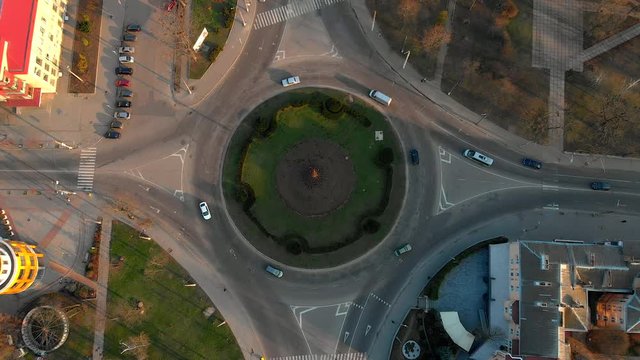 4k aerial view timelapse of roundabout road with circular cars at late autumn