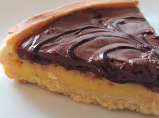 Semolina cake (torta di semolino) with chocolate. Italian cuisine. Slice of chocolate cake, close up.