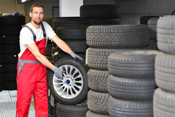 department store with car tyres in a garage - tyre change