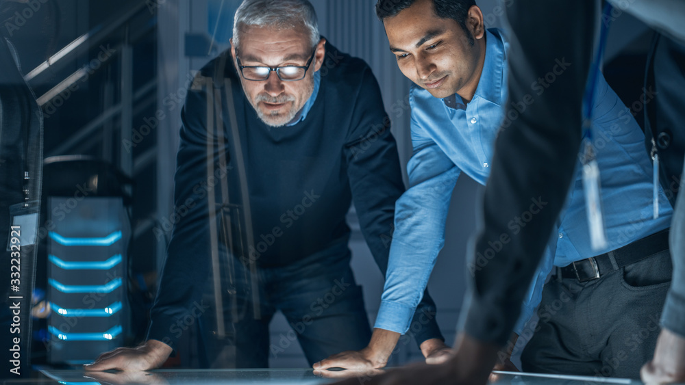 Aufkleber Engineers Meeting in Technology Research Laboratory: Engineers, Scientists and Developers Gathered Around Illuminated Conference Table Talking and Finding Solution, Inspecting Industrial Engine Design