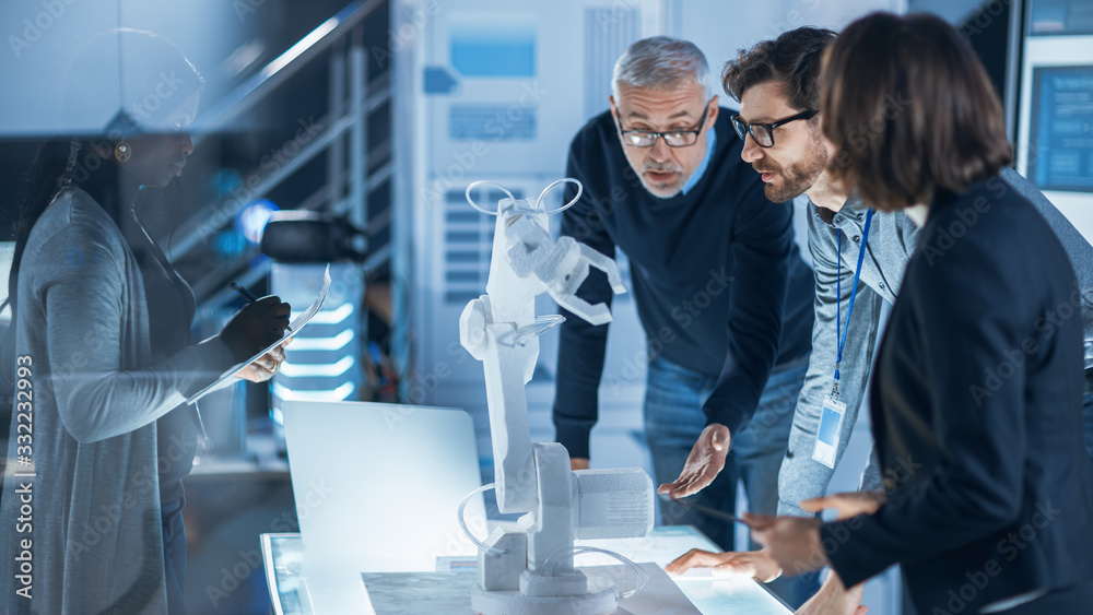 Aufkleber Engineers Meeting in Robotic Research Laboratory: Engineers, Scientists and Developers Gathered Around Illuminated Conference Table, Talking, Using Tablet and Analysing Design of Industrial Robot Arm