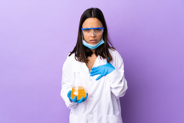 Scientist woman investigating a vaccine to cure coronavirus disease pointing to oneself