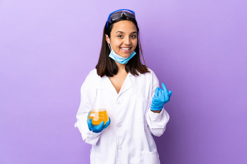 Scientist woman investigating a vaccine to cure coronavirus disease inviting to come with hand. Happy that you came