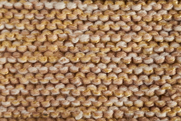 Knitted texture in beige macro with a handkerchief technique