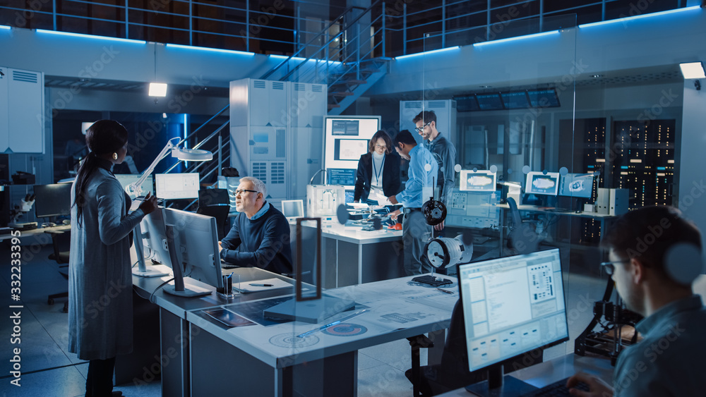 Poster Diverse International Team of Industrial Engineers and Scientists Working in Research Laboratory / Development Center. People Working on New Efficient Engine Concept Design. Professionals Teamwork